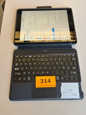 a laptop computer sitting on a table with a price tag on it