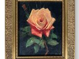 painting of a rose in a gold frame on a black background