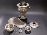 a lot of silver items that are on a table