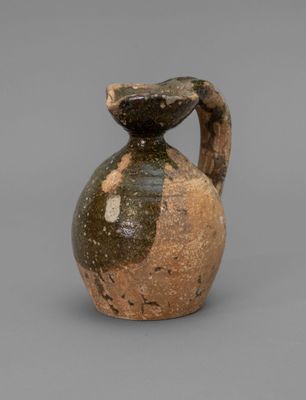 an image of a vase with a bird on top of it