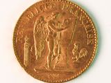 a gold coin with a picture of an angel on it