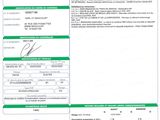 a green and white document with a picture of a person on it