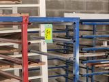 a rack with a bunch of trays on it in a warehouse