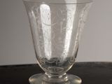 a glass vase sitting on top of a wooden table