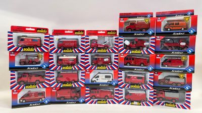 a lot of red and white toy vehicles in the box
