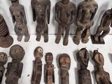 a lot of wooden figurines sitting on a table