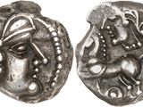 a silver coin with an image of a woman and a horse