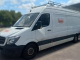 a white van that is parked in a parking lot
