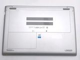 a silver laptop with a blue sticker on it