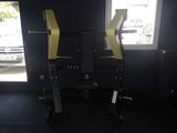 a picture of a gym room with a bench and a pull up bar
