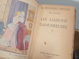 a book with a picture of a woman in a dress sitting on top of a table