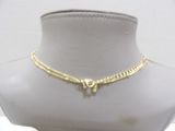 gold plated necklace with a heart charm on a mannequin neck