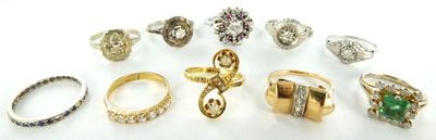 many different types of rings on a white surface
