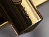 a close up view of a golden cup on a table