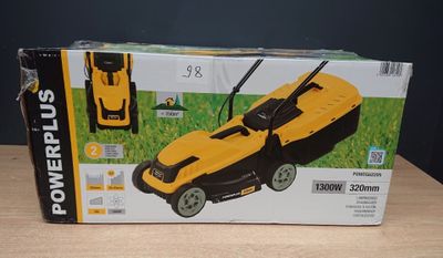 yellow and black powerplus lawn mower in a box on a table