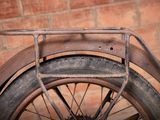 a close up of a bicycle with a basket on the back