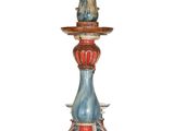 a blue and red candle that is on top of a table