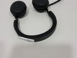 a pair of black headphones on a white table
