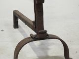 an old iron stool that is sitting on the floor