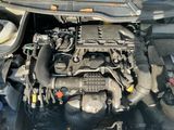 a picture of a car engine with its hood open