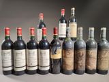 plusieurs bouteilles de vin sont alignées sur une table