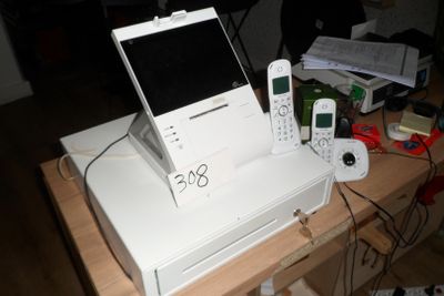 a white computer sitting on top of a white printer