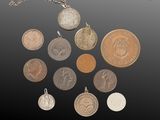 an assortment of coins are arranged in a circle on a black surface