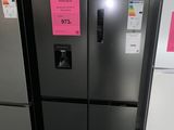 three refrigerators that are sitting side by side in a room