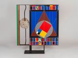 an image of a sculpture of a clock and a book on a stand