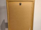 an empty canvas on a wooden easel with a box on it