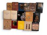 a lot of books that are sitting on a white surface