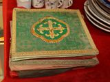 a book with a cross on it sitting on a table