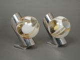 pair of silver and gold cufflinks with white glass balls