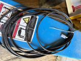 a blue machine with a bunch of wires on top of it