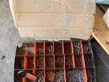 a tool box filled with many different types of screws