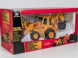 toy construction vehicle in a box on a white surface