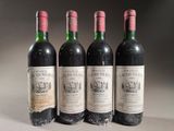 three bottles of red wine are lined up on a table
