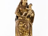 an image of a statue of a woman holding a baby in her lap