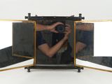 a man taking a picture of himself in a mirror