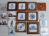 a lot of blue and white tile pictures on the wall