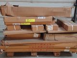 a pile of boxes sitting on a pallet in a garage