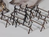 several pieces of metal are arranged on a white surface