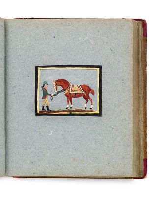 une photo d'un livre sur lequel figure l'image d'un homme et d'un cheval