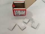 a small box with some small pieces of paper in it