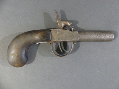 a gun that is sitting on a table