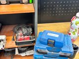 a shelf with a bunch of tools on top of it