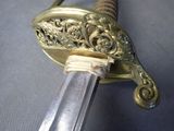 a sword that is on display on a table
