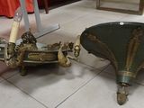 a table with a clock on it next to a table with a umbrella