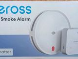the box of a smart smoke alarm is sitting on the table