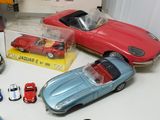 many toy cars that are sitting on a table